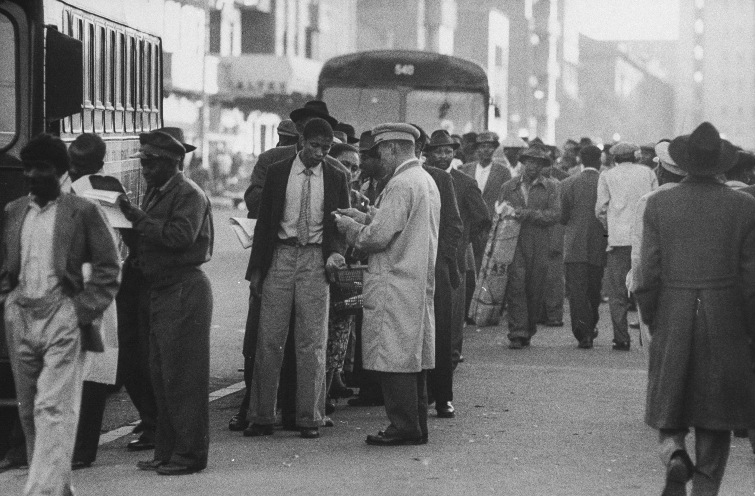 1 April 1960: Workers categorised as coloured under apartheid queue for hours for the bus at the end of the working day to return to their township homes. (Photograph by Grey Villet/ The LIFE Picture Collection via Getty Images)
